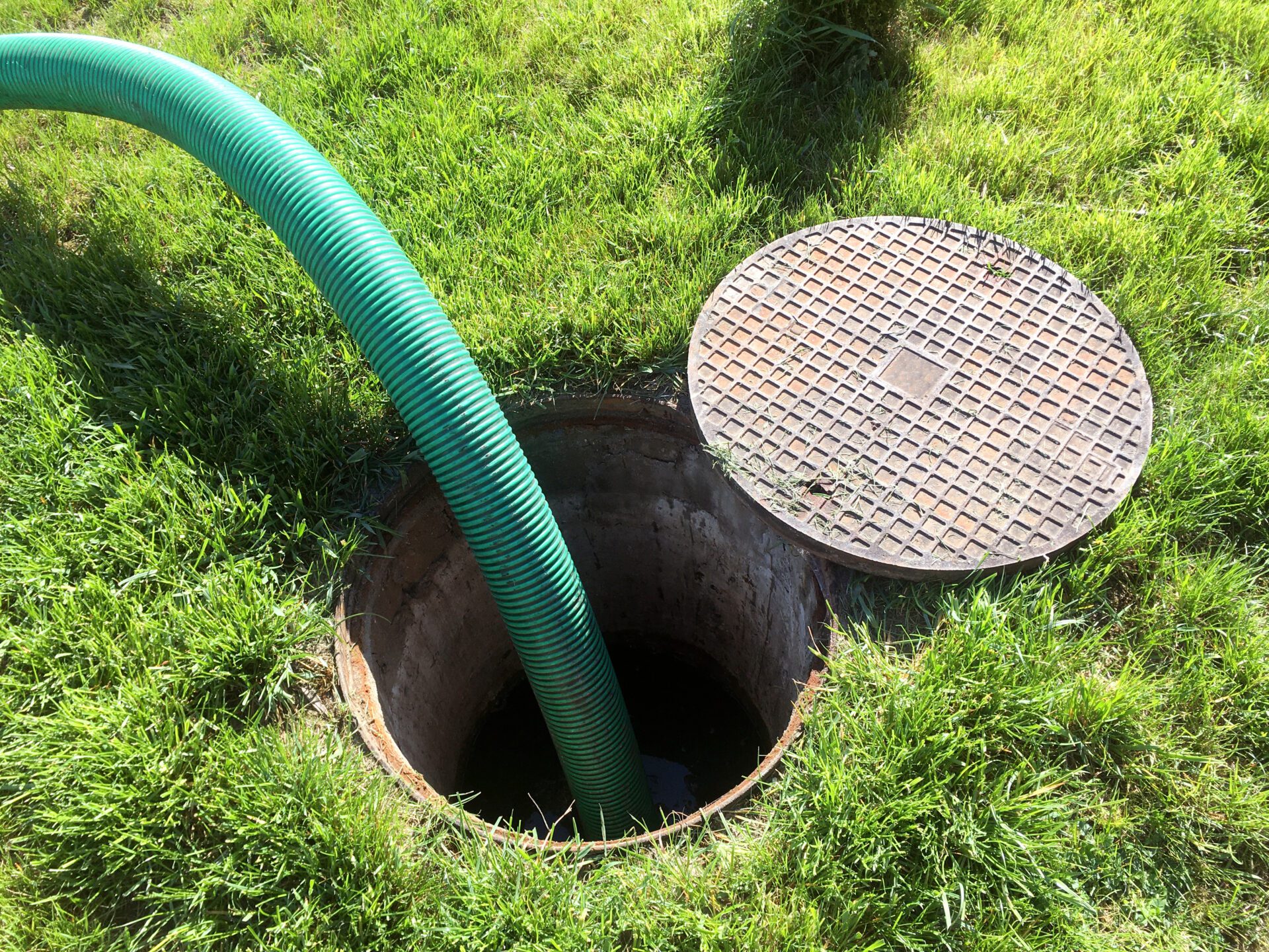 Emptying a clogged septic tank.